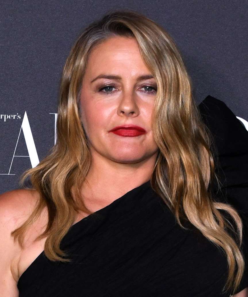 Alicia Silverstone Long Wavy    Brunette   Hairstyle with Side Swept Bangs  and  Blonde Highlights