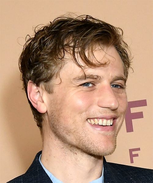 Johnny Flynn Short Wavy    Hairstyle with Side Swept Bangs - side on view