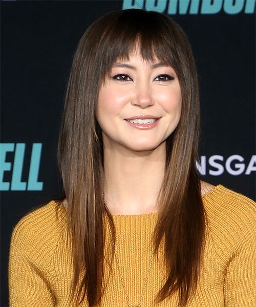 Kimiko Glenn Long Straight    Hairstyle with Blunt Cut Bangs - side on view